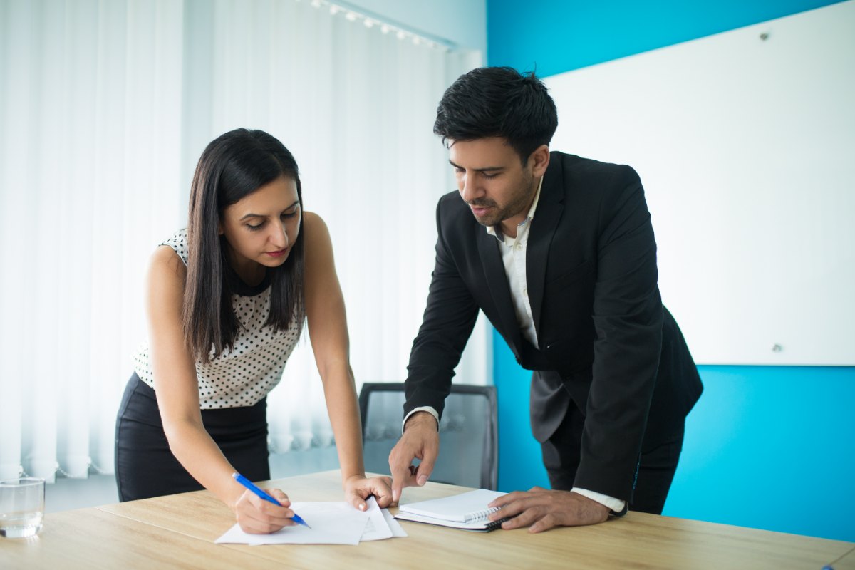 Two advisors working through a client file together